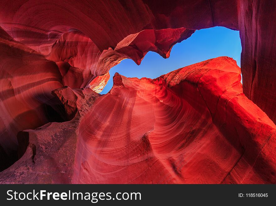 Beautiful wide angle view of amazing sandstone formations in famous Antelope Canyon on a sunny day with blue sky near the old town of Page at Lake Powell, American Southwest, Arizona, USA. Beautiful wide angle view of amazing sandstone formations in famous Antelope Canyon on a sunny day with blue sky near the old town of Page at Lake Powell, American Southwest, Arizona, USA