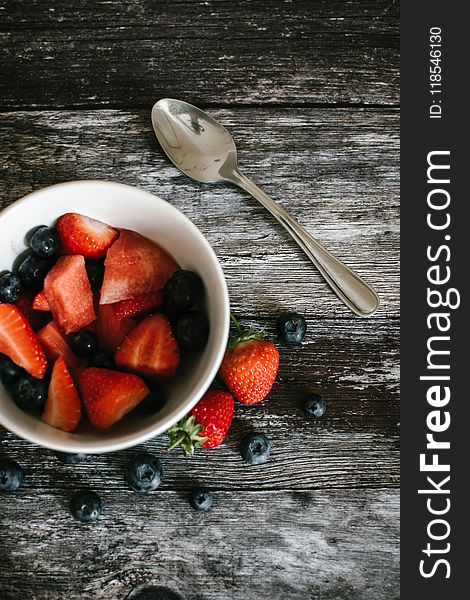 Photography of Strawberries And Blueberries On Bowl