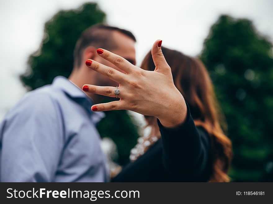 Shallow Focus Photography of Man and Woman Kissing Each Other