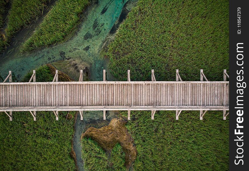 Top Down Aerial View Over Wooden Footbridge In Zelenci,Slovenia