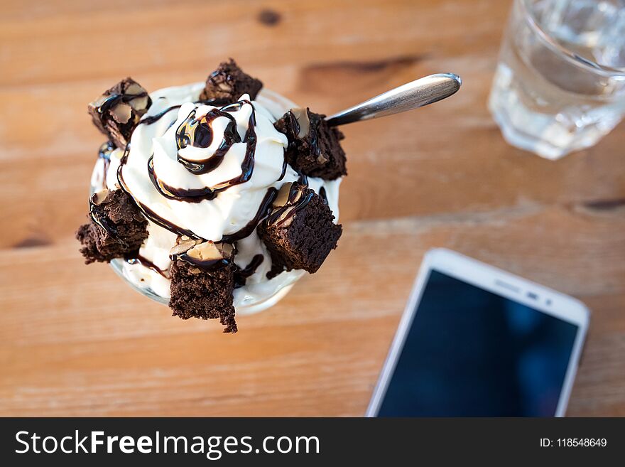 Ice cream and brownies on a table in a coffee shop. Ice cream and brownies on a table in a coffee shop.