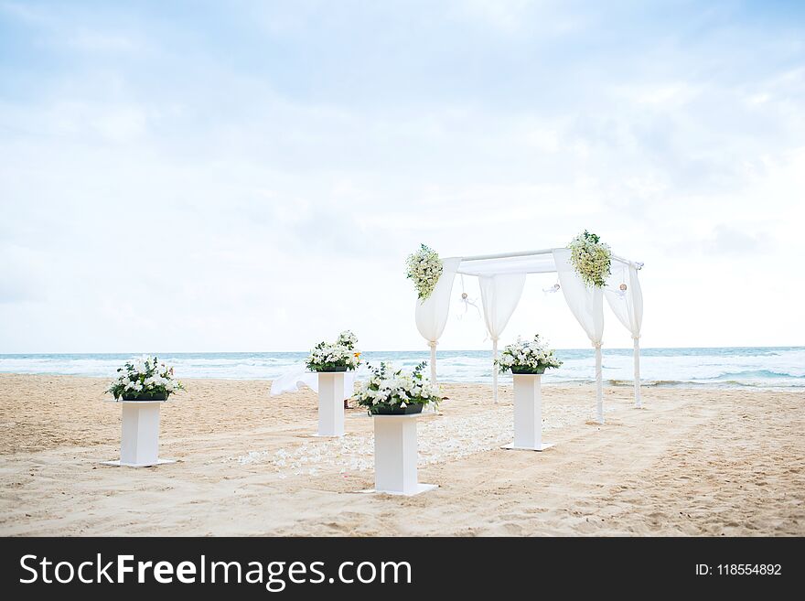 Romantic Wedding Setting On The Beach And Blue Sky.