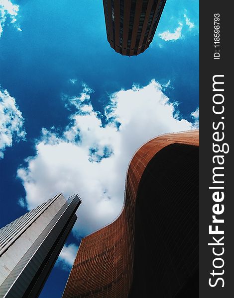 Brown And White Concrete Buildings Under Blue Sky Photography