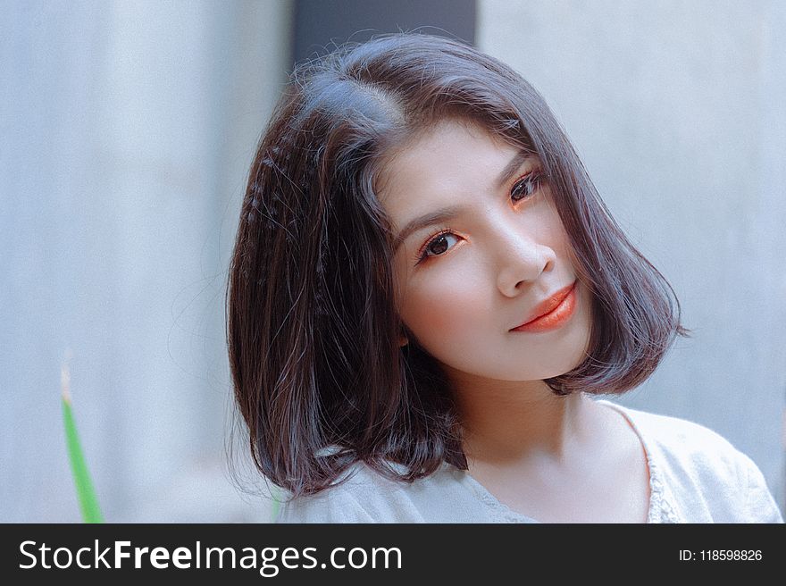 Selective Focus Photography Of Woman Wearing White Shirt