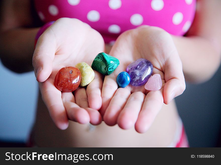 Woman Holding Six Polished Stones