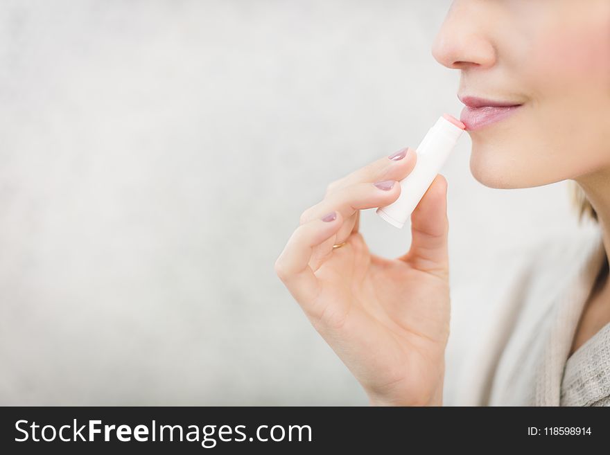 Woman About To Apply Pink Lip Balm