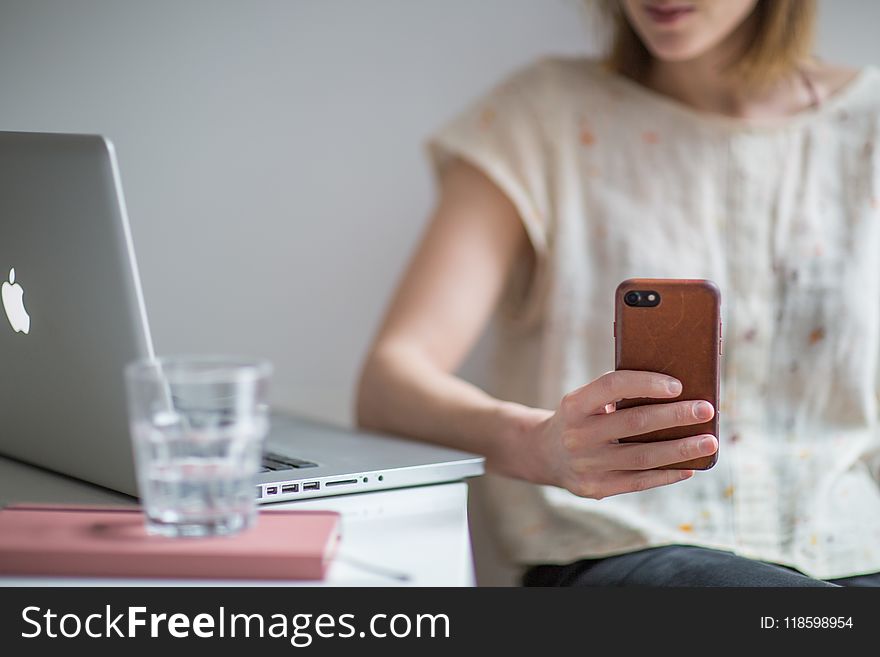 Photo of Woman Holding Smartphone