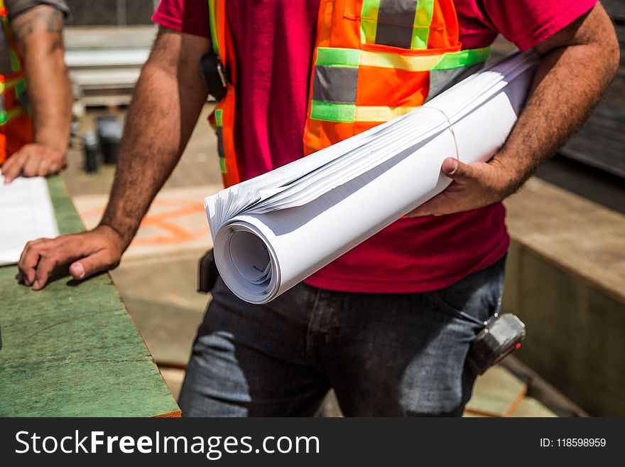 Person Holding Drafting Paper