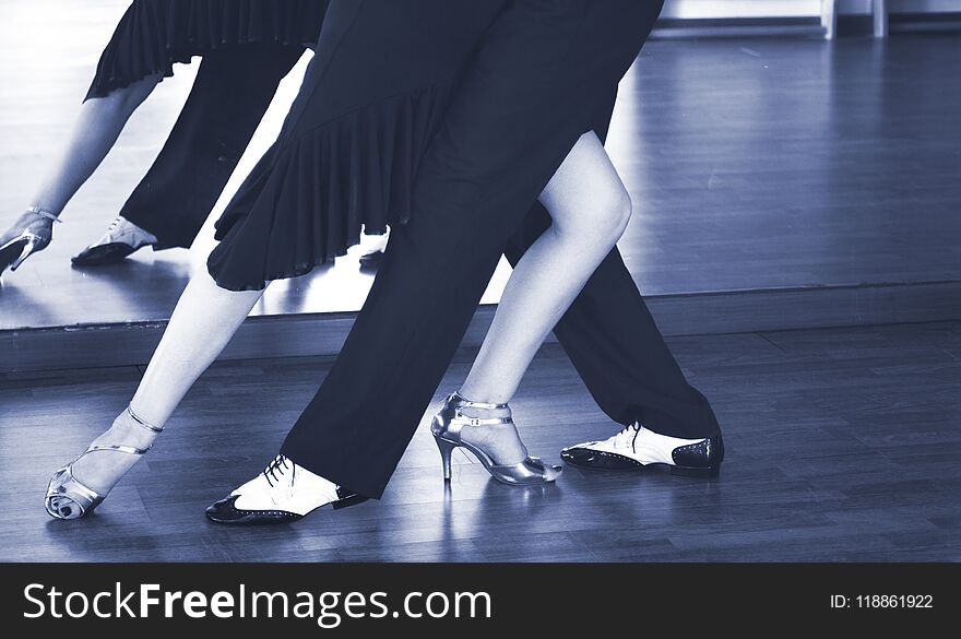 Ballroom dance couple of dancers and teachers in studio school dancing in rehearsal. Ballroom dance couple of dancers and teachers in studio school dancing in rehearsal.