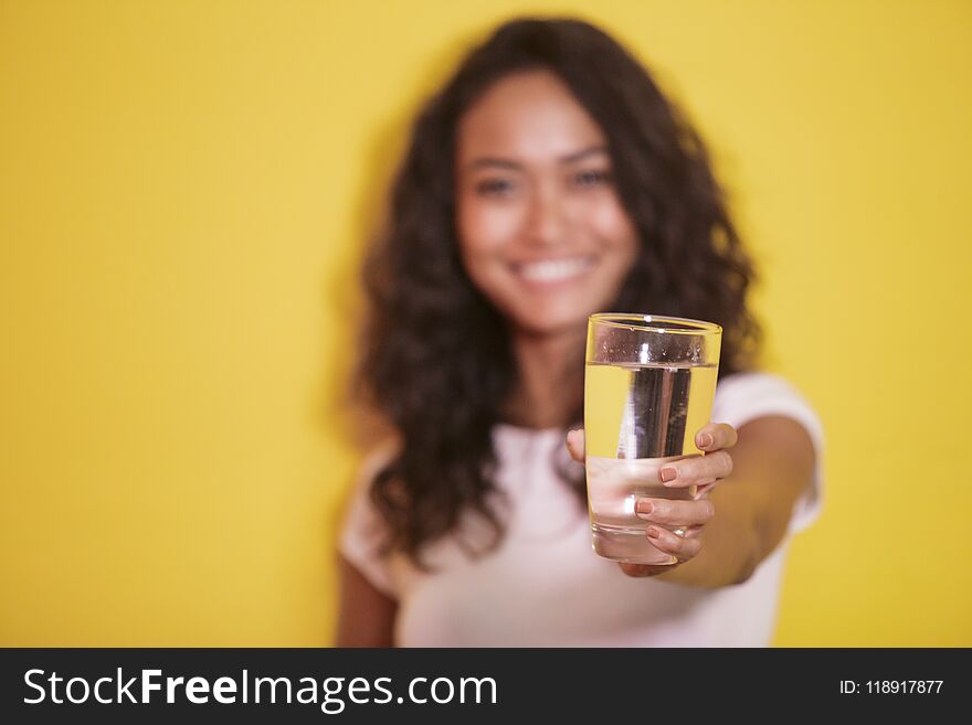 A glass of mineral water hold by asian girl