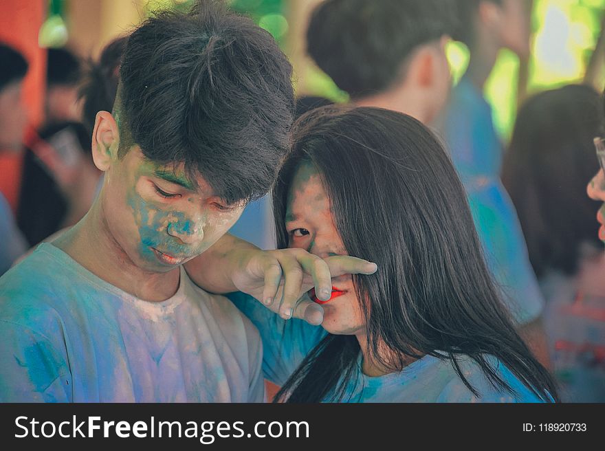 Man and Woman Covered in Blue Powder