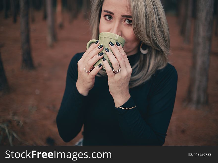 Woman Holding Grey Ceramic Mug