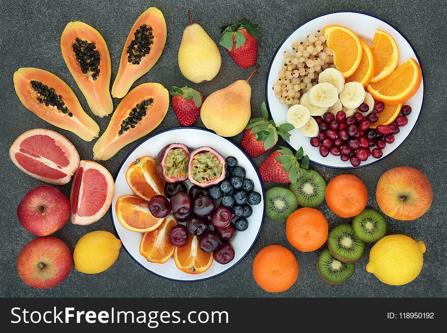 High dietary fiber health food concept with fresh fruit selection on marble background top view. Foods high in antioxidants, anthocyanins and vitamins. High dietary fiber health food concept with fresh fruit selection on marble background top view. Foods high in antioxidants, anthocyanins and vitamins.