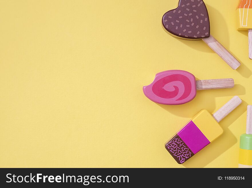 Ice Cream Popsicles Lollipops On A Pastel Yellow Background