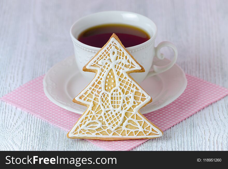 Christmas Tree Gingerbread With Coffe Cup On Wooden Table With Pink Napkin, Closeup