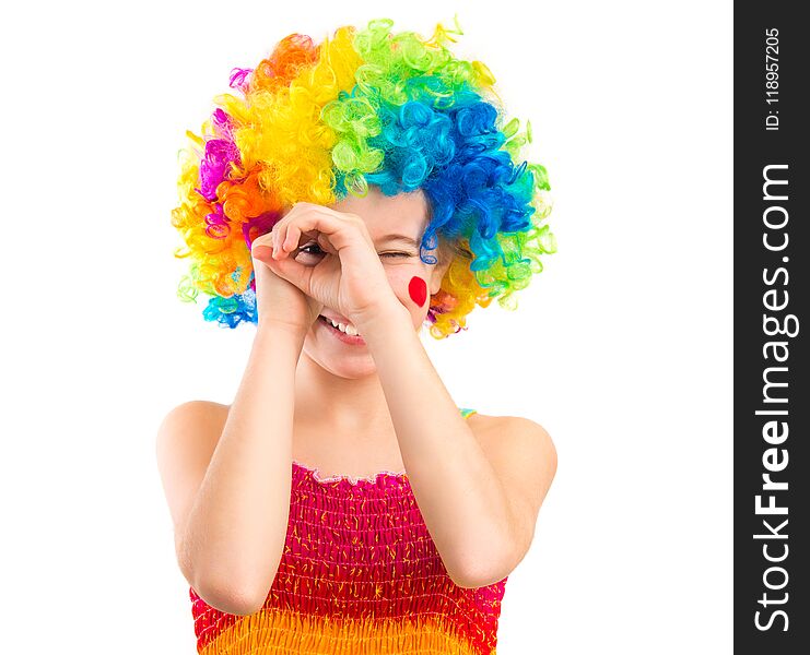 Little girl in clown wig isolated on white background