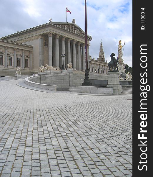 The architect Theohil Hansen chose a strict Neo-Clasical style when he designed the immense Parliament building. The parliament building was originally constructed as part of the Ringstrasse development to act as the Reichsrat building (the Parliament of the Austrian part of the Habsburg empire). Construction began in 1874 and finished in 1884. The front is guarded by the bronze Horse Tamers (1901. The architect Theohil Hansen chose a strict Neo-Clasical style when he designed the immense Parliament building. The parliament building was originally constructed as part of the Ringstrasse development to act as the Reichsrat building (the Parliament of the Austrian part of the Habsburg empire). Construction began in 1874 and finished in 1884. The front is guarded by the bronze Horse Tamers (1901