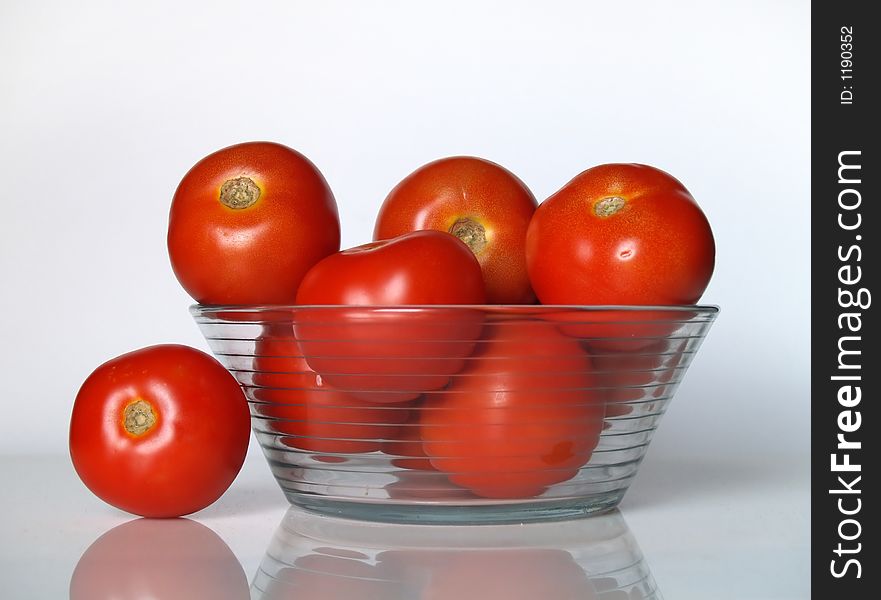 Tomatoes in a glass bowl. Tomatoes in a glass bowl