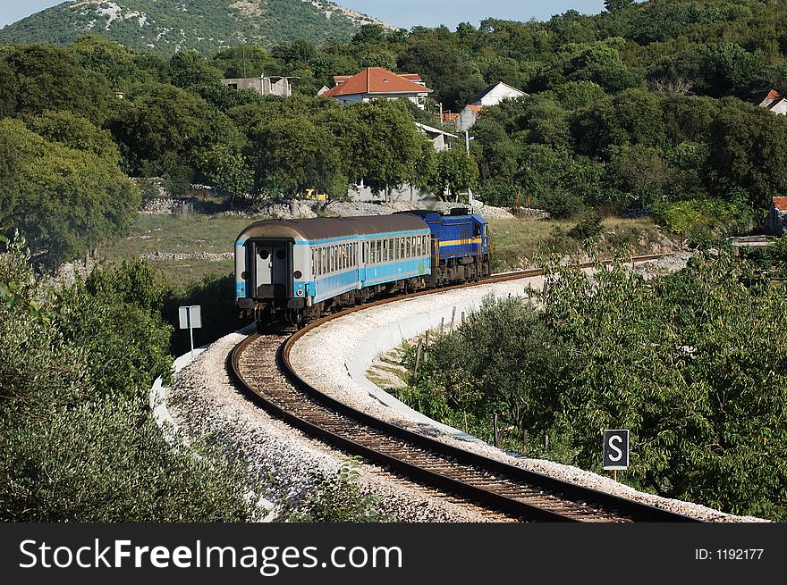 Small diesl train leaving from station