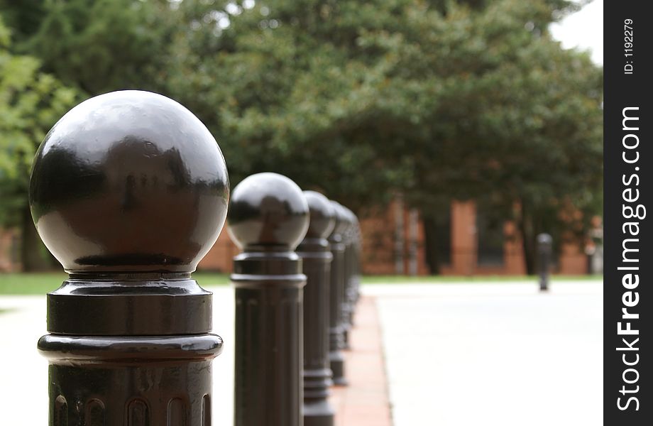 Row of Black Posts creating a security barrier. Row of Black Posts creating a security barrier