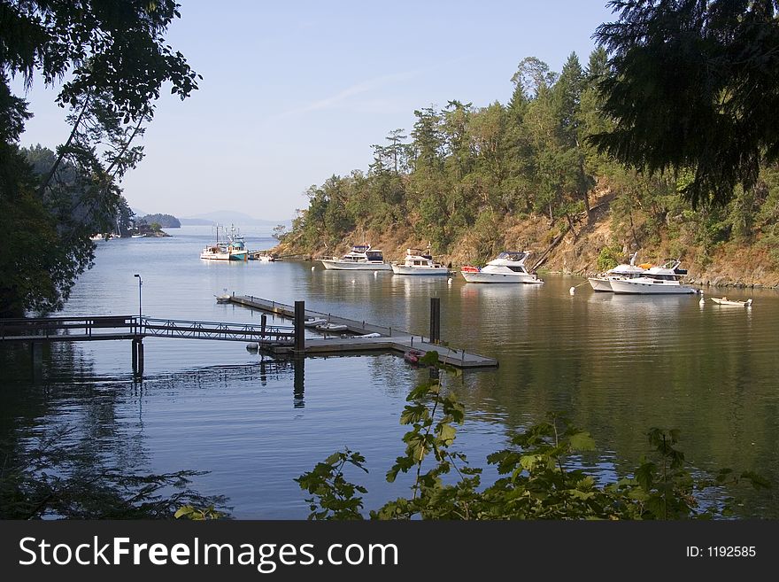 A hidden cove in British Columbia, Canada provides a tranquil location for this marina. A hidden cove in British Columbia, Canada provides a tranquil location for this marina.
