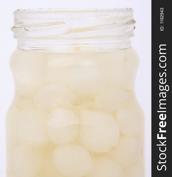 Jar of pickled onion, isolated on white, macro with copy-space, copy space. Jar of pickled onion, isolated on white, macro with copy-space, copy space.