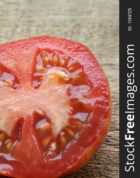 Detail of sliced heirloom red tomato. Detail of sliced heirloom red tomato