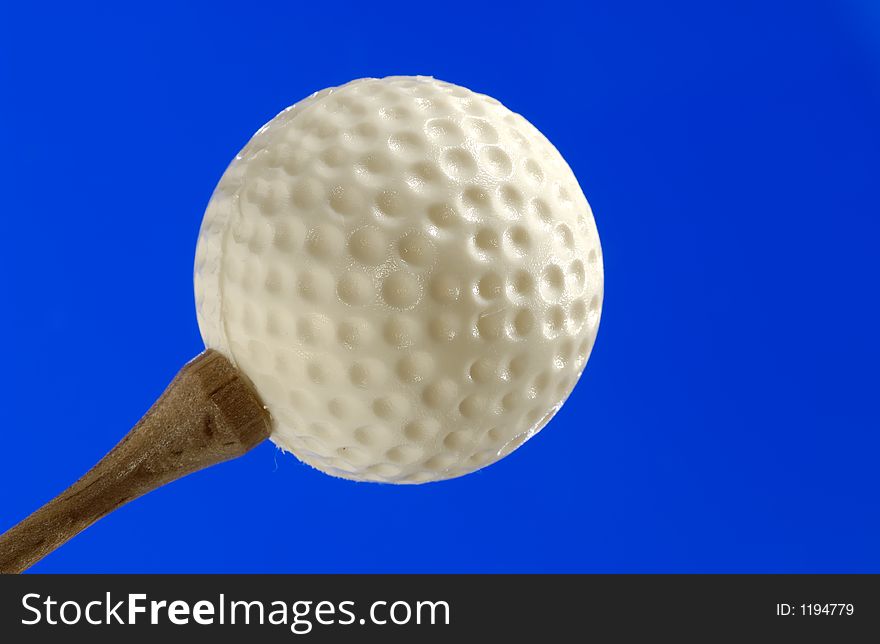 Photo of a Golf Ball and Tee. Photo of a Golf Ball and Tee