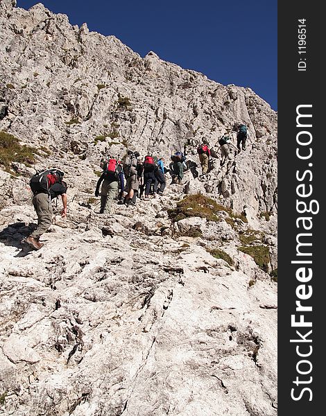 Trekkers in the Dolomites on via ferrata,Italy