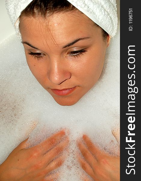 Beautiful girl taking bath with foam. Beautiful girl taking bath with foam