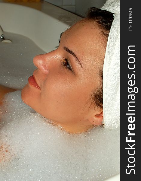 Beautiful girl taking bath with foam. Beautiful girl taking bath with foam