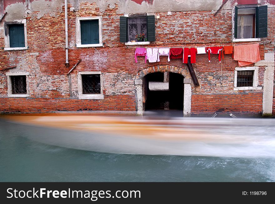 Washing hanging out, in one of the many small canals that makes up the beauty of Venice.
A boat is wizzing by!. Washing hanging out, in one of the many small canals that makes up the beauty of Venice.
A boat is wizzing by!
