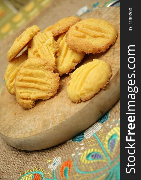 Home made butter cookies on a wooden chopping board