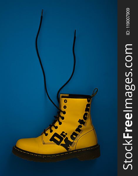 Unpaired Yellow Dr. Martens Lace-up Boot