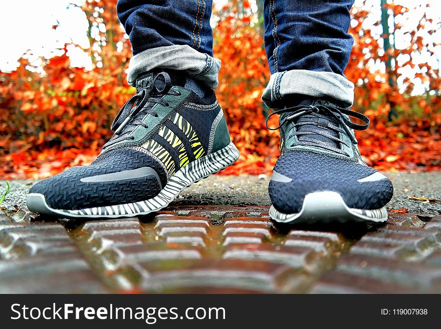 Shallow Focus Photography of Pair of Black Black-and-white Adidas Running Shoes