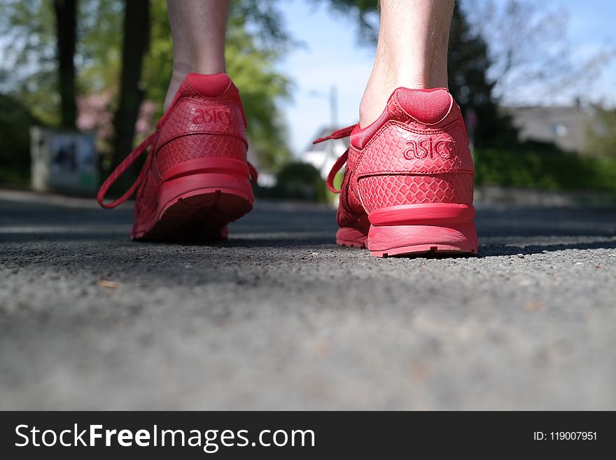 Photo Of Person Wearing Red Low-top Sneakers