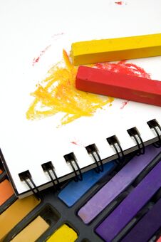 Vertical Image Of Colorful Pastel Crayons And Coloring Book Stock Photos