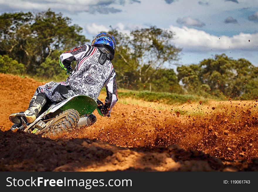 Man Riding Motocross Dirt Bike On Track