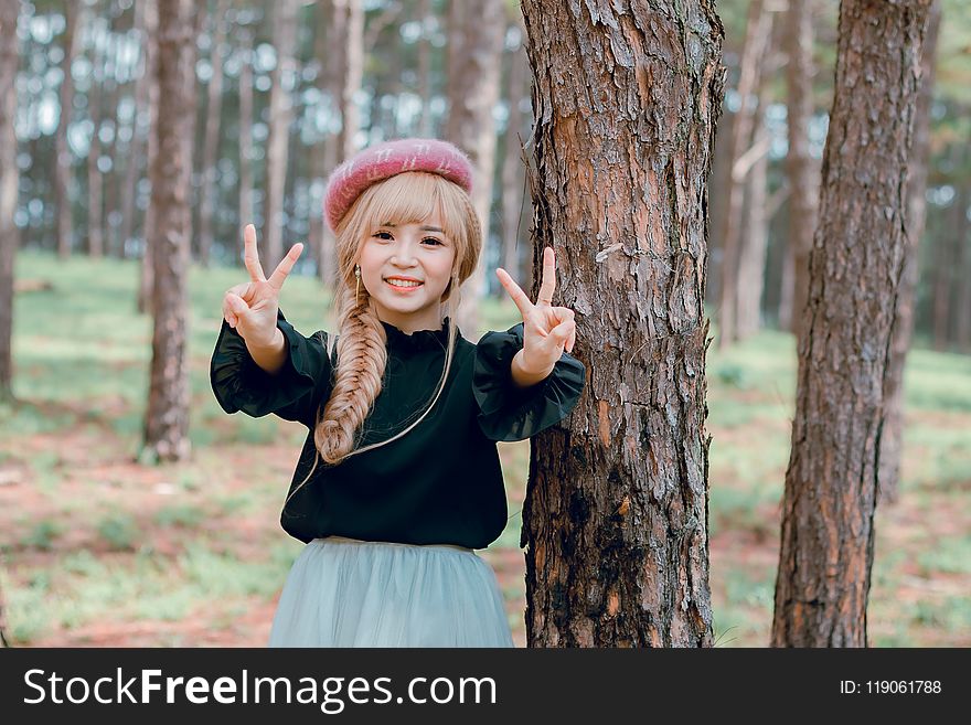 Girl Wearing Black Shirt Standing Near Tree