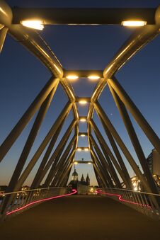 Two Red Light Trails From Two Bicycles On A Modern Bridge Stock Images