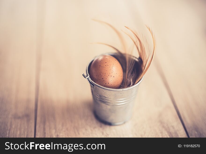 Chicken raw eggs on wooden table. Vintage tone.