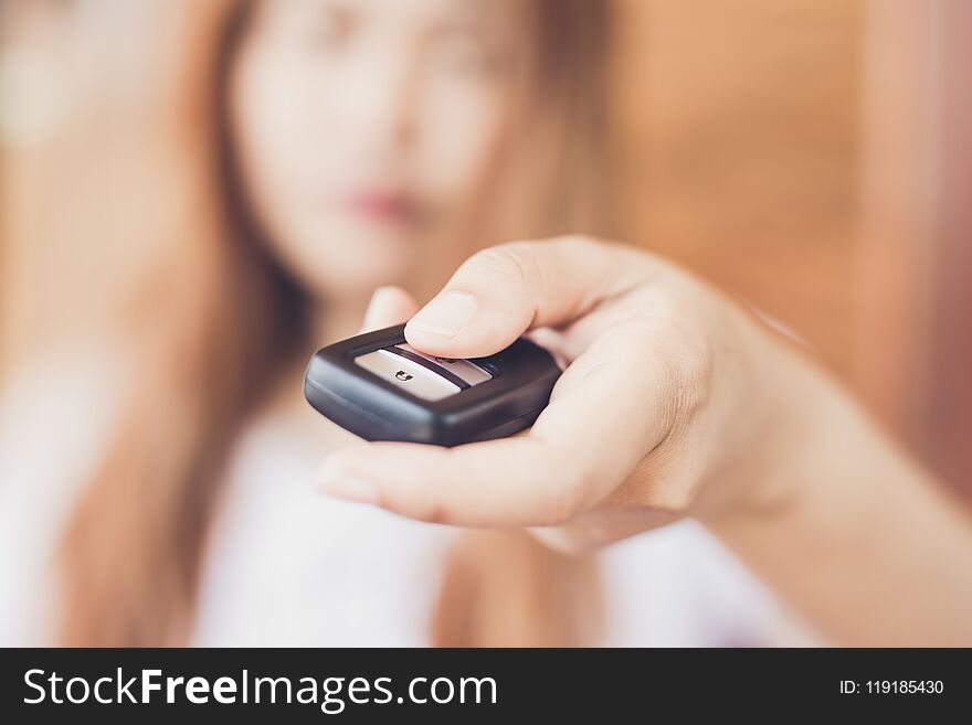 Women Hand Holding Car Remote Control Key