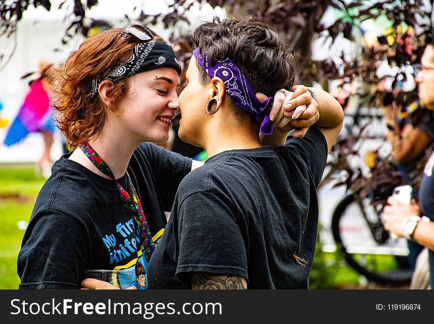 Photo Of Women Facing Each Other