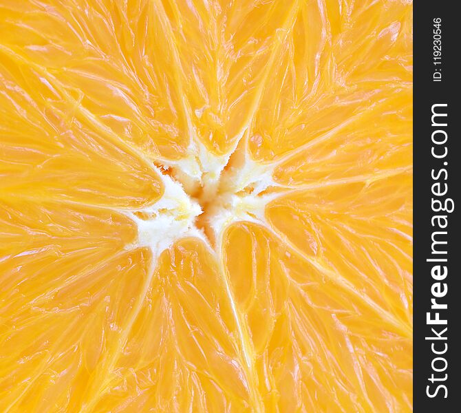 Top view of a fragment of the orange fruit slice close up. Macro
