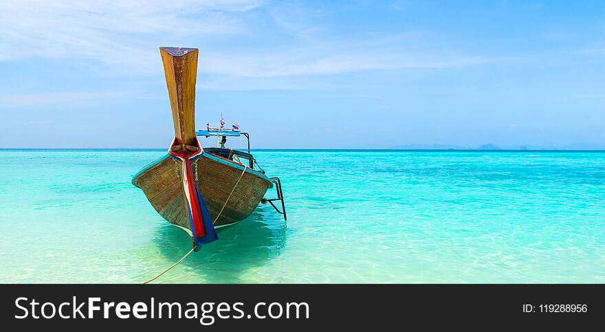 Amazing view of beautiful beach with traditional thailand longtale boat. Location: Bamboo