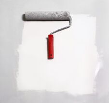 Paint Roller Painting On White Paper.background. Stock Photo