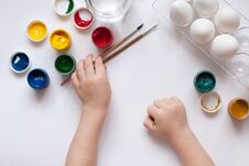 Children`s Hands Paint Easter Eggs. The Child Is Drawing, Step By Step. Royalty Free Stock Image Children`s Hands Paint Easter Eggs. The Child Is Drawing, Step By Step. Royalty Free Stock Image