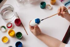 Children`s Hands Paint Easter Eggs. The Child Is Drawing, Step By Step. Stock Photos