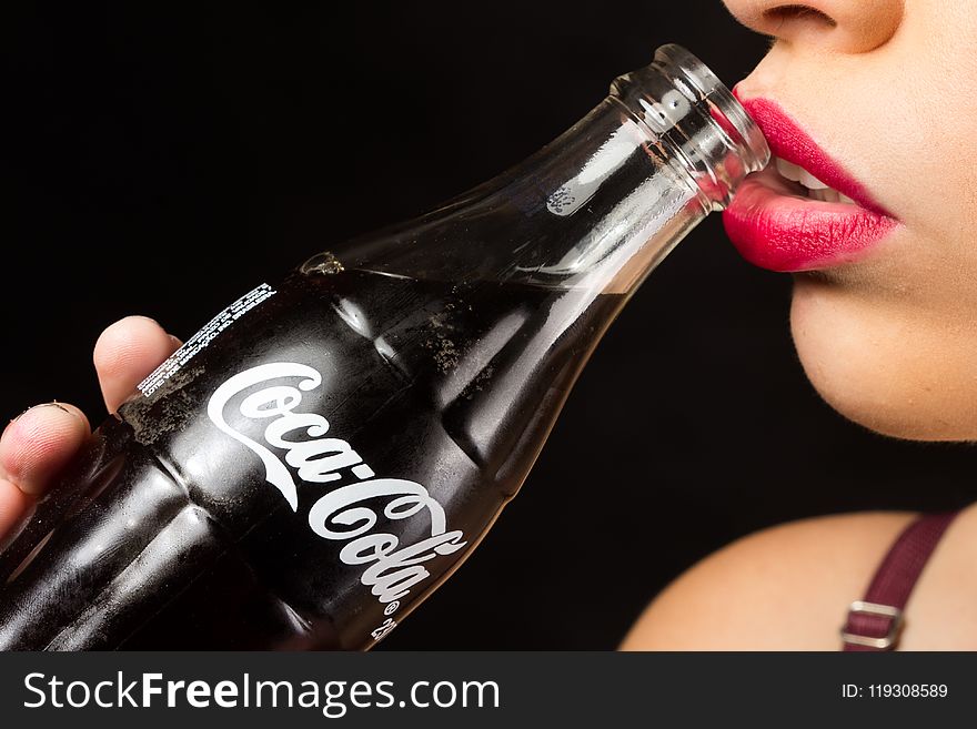 Woman About To Drink Coca-cola Glass Bottle