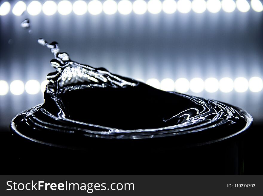 Water splashing and ripple occurs with lighting background,